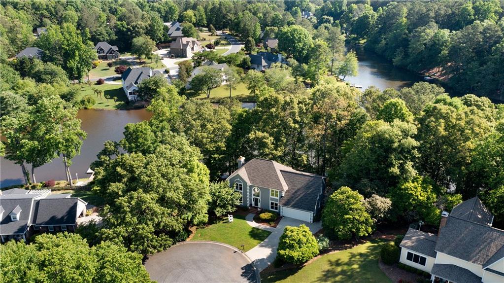 24 Commerce Row Northeast Cartersville, GA 30121 - Photo 2 of 37 an aerial view of a house with a yard and lake view