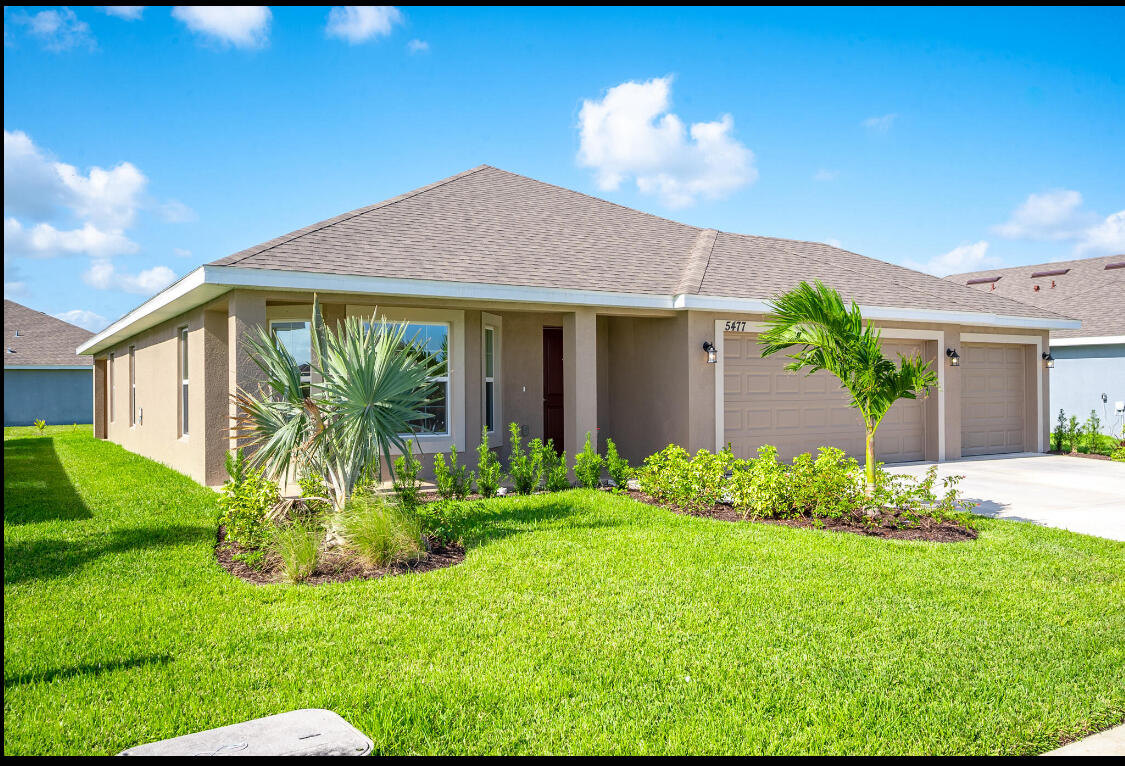 5536 Lugo Street Fort Pierce, FL 34951 - Photo 2 of 33 a view of a house with a yard