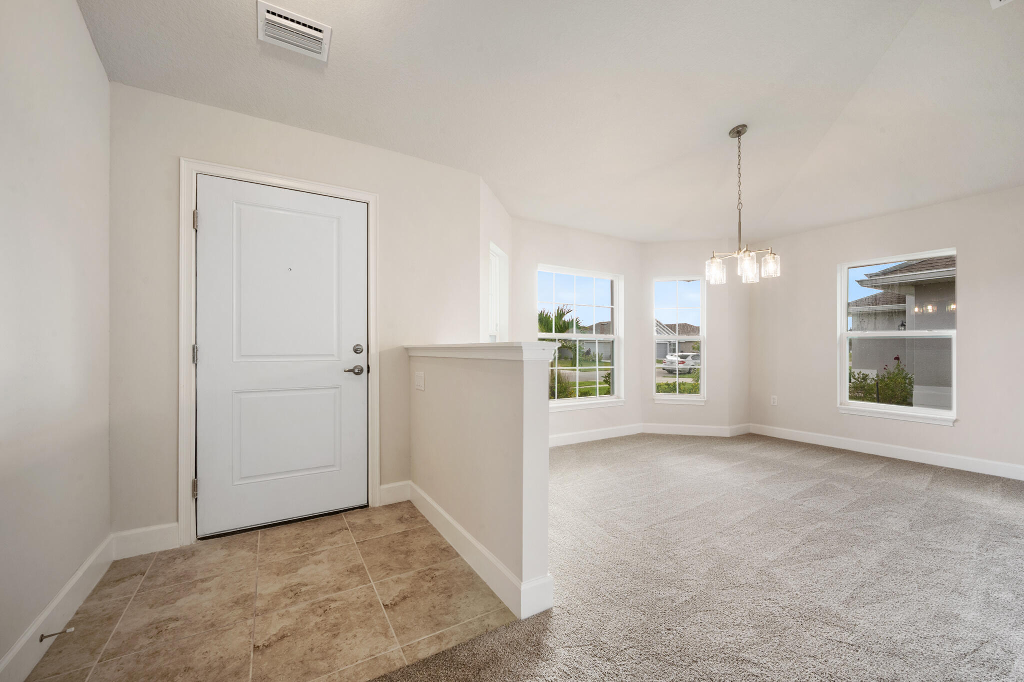 5536 Lugo Street Fort Pierce, FL 34951 - Photo 4 of 33 an empty room with windows and outdoor view