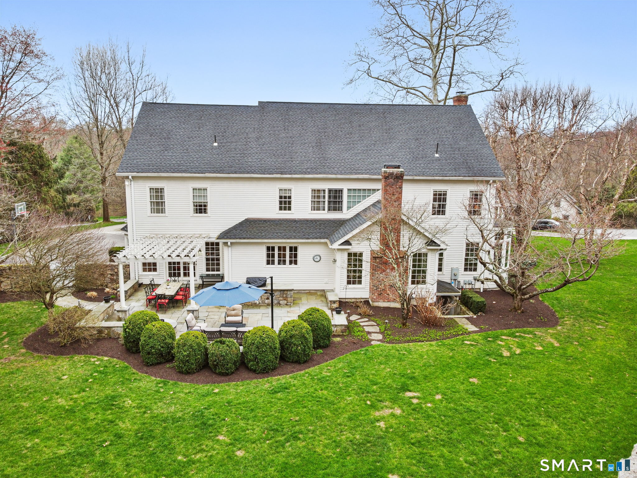 18 Brandon Circle Wilton, CT 06897 - Photo 2 of 40 front view of a house with a big yard
