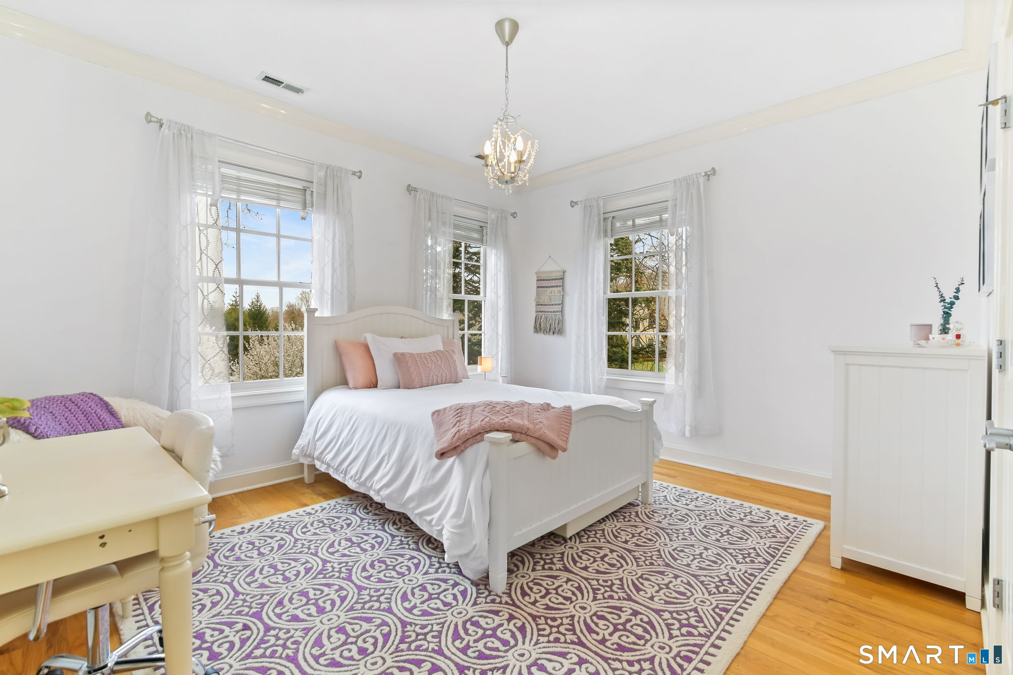 18 Brandon Circle Wilton, CT 06897 - Photo 26 of 40 a bedroom with a bed rug and window