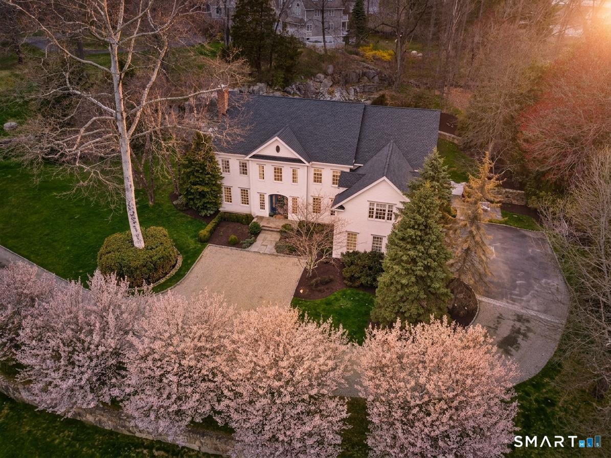 18 Brandon Circle Wilton, CT 06897 - Photo 6 of 40 a view of house with a yard and green space