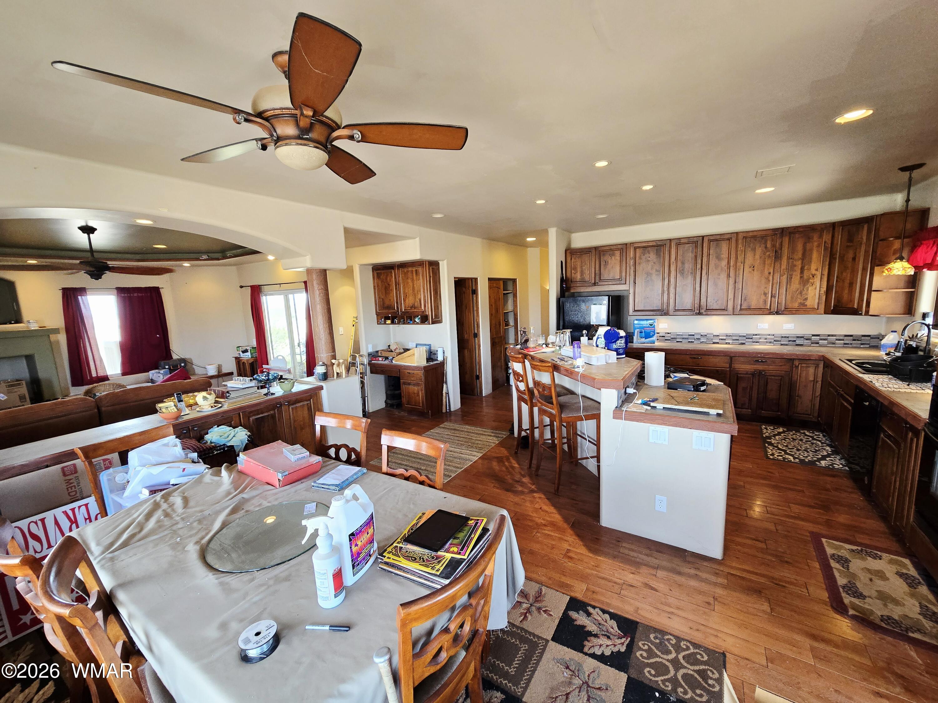 9046 Miller Trail Snowflake, AZ 85937 - Photo 6 of 34 a living room with furniture kitchen view and a wooden floor