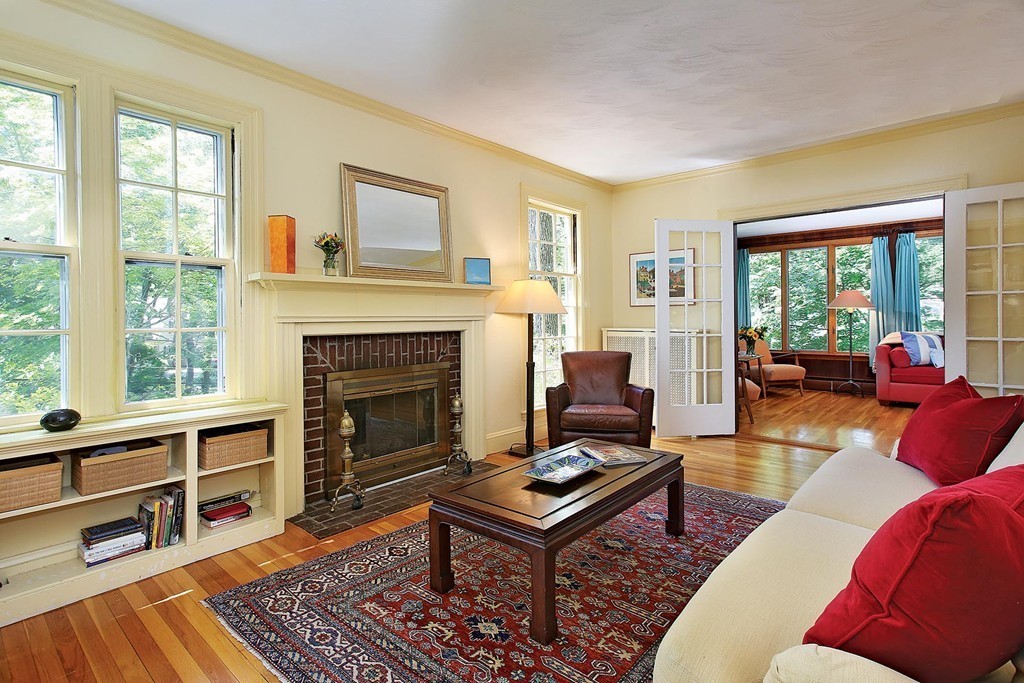 37 Alban Road Newton, MA 02468 - Photo 2 of 10 a living room with furniture a rug wooden floor and a fireplace
