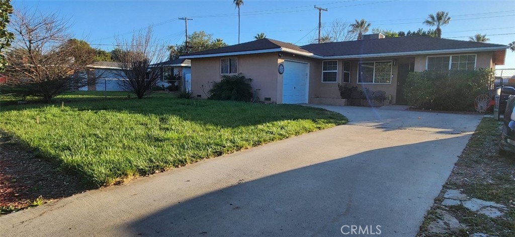 4116 Mescale Road Riverside, CA 92504 - Photo 1 of 1 a view of a house with a yard and potted plants