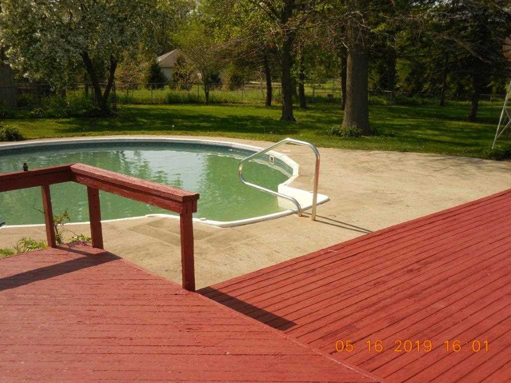7135 Ralph Road Rockford, IL 61109 - Photo 4 of 16 a view of a swimming pool with a patio