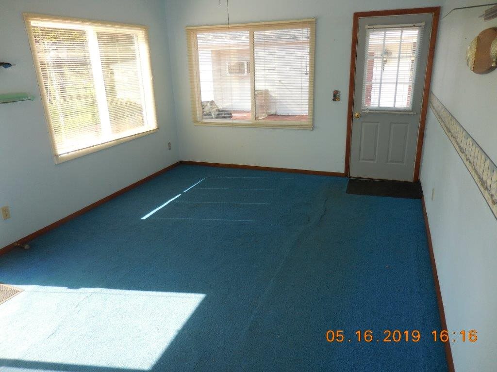 7135 Ralph Road Rockford, IL 61109 - Photo 6 of 16 a view of an empty room with a window