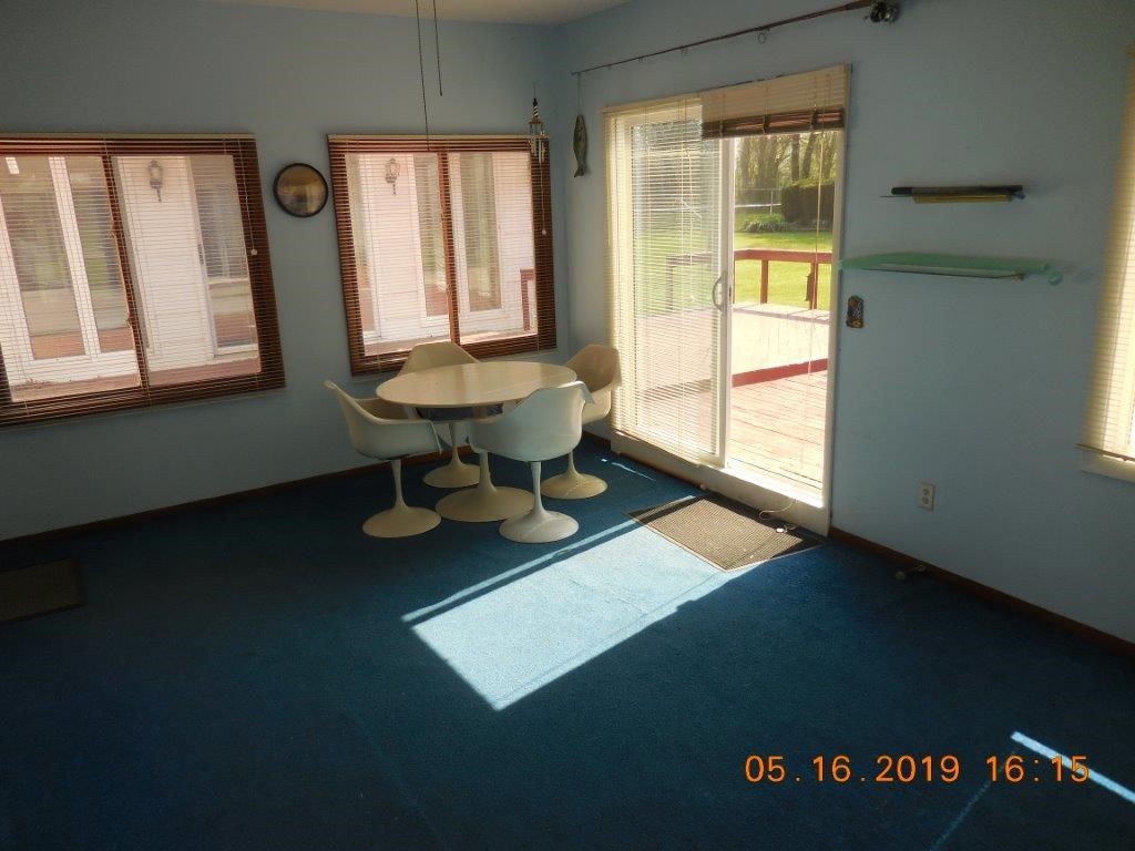 7135 Ralph Road Rockford, IL 61109 - Photo 7 of 16 a room with furniture and a window