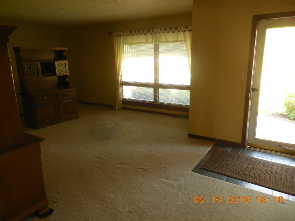 7135 Ralph Road Rockford, IL 61109 - Photo 9 of 16 a view of an empty room with a window