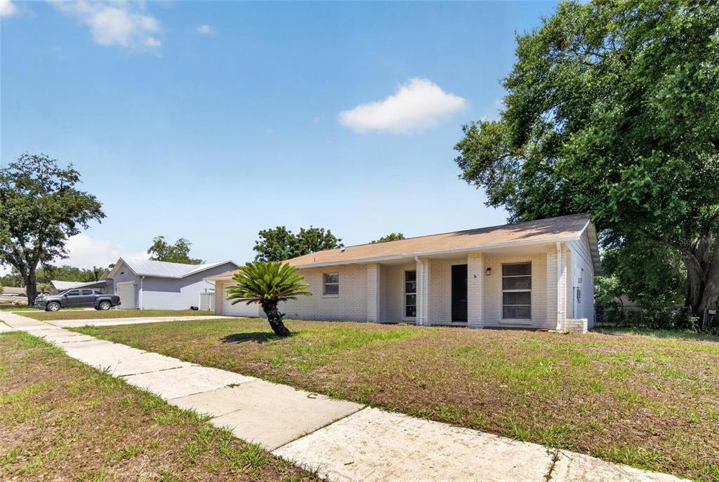 2340 Merrily Circle South Seffner, FL 33584 - Photo 4 of 52 a view of a house with a yard and sitting area