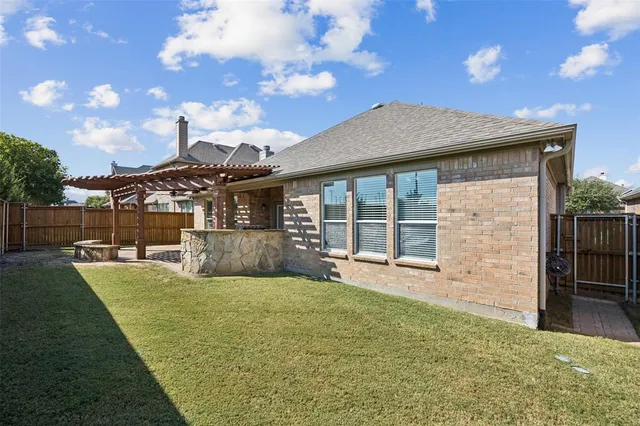 a view of a backyard with a garden and plants