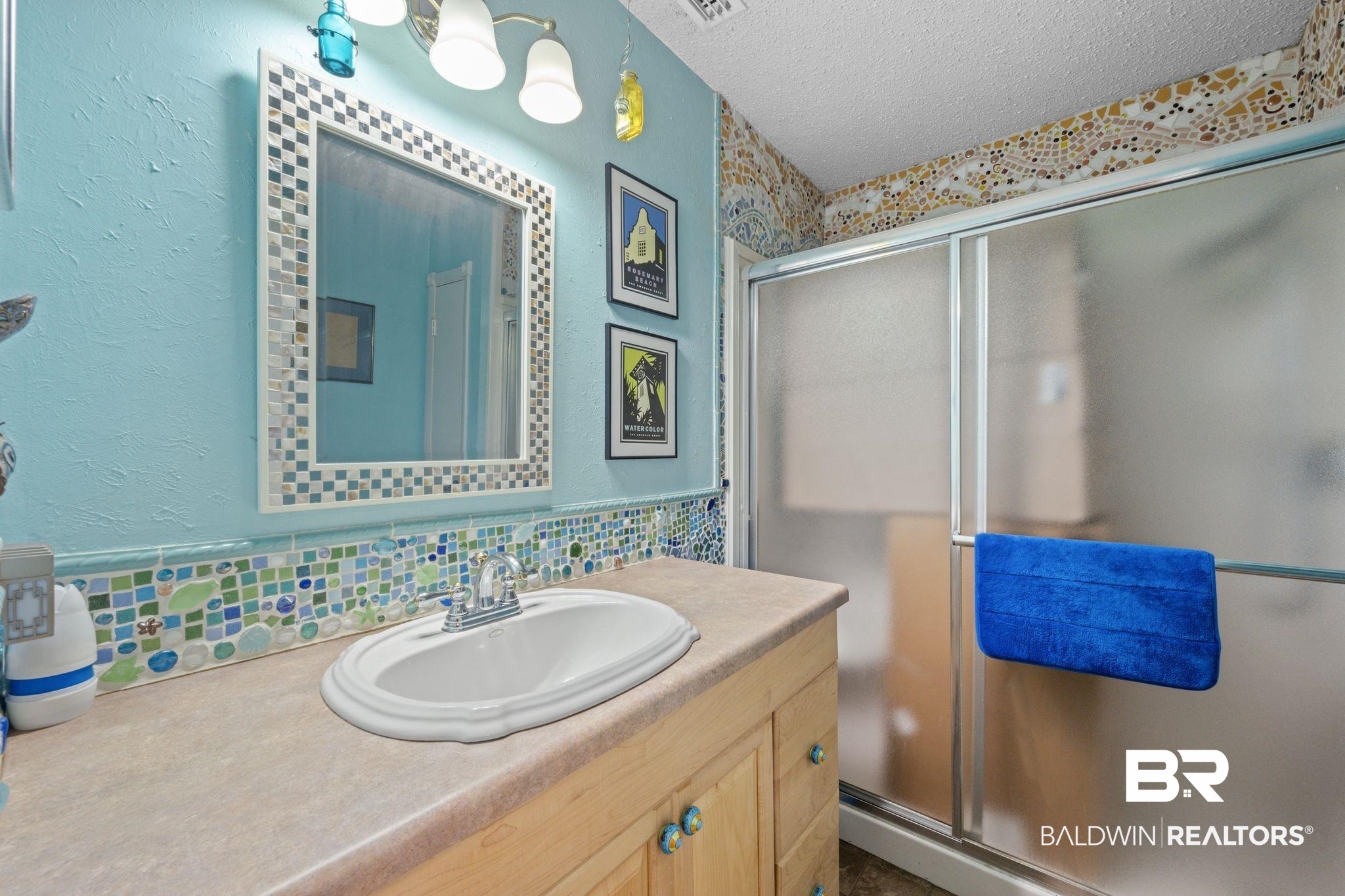 40 Caisson Trace Daphne, AL 36527 - Photo 17 of 54 Bathroom with walk in shower, backsplash, and a vanity.