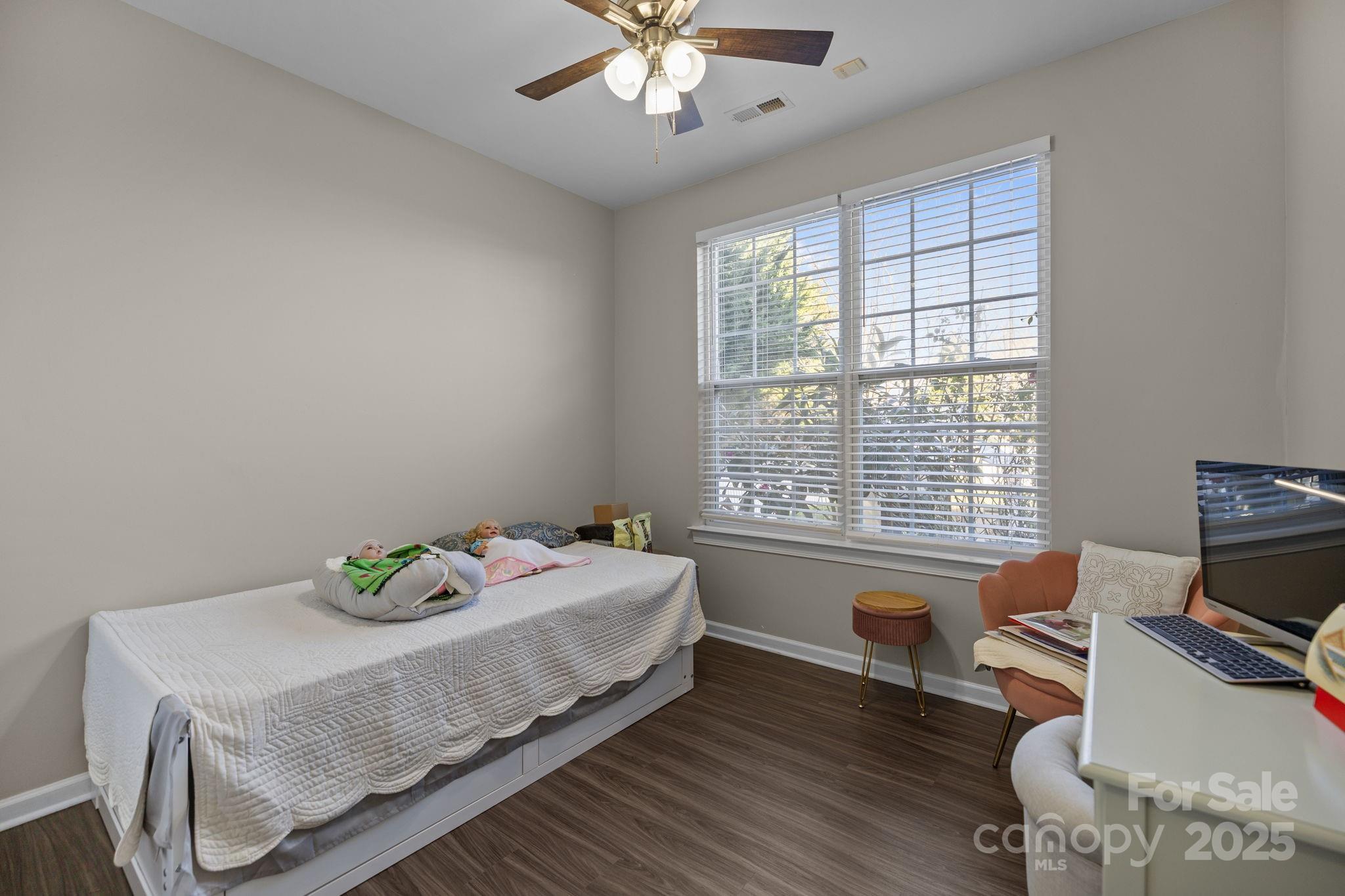 6416 Baltray Road Charlotte, NC 28278 - Photo 15 of 34 a bedroom with a bed and a window