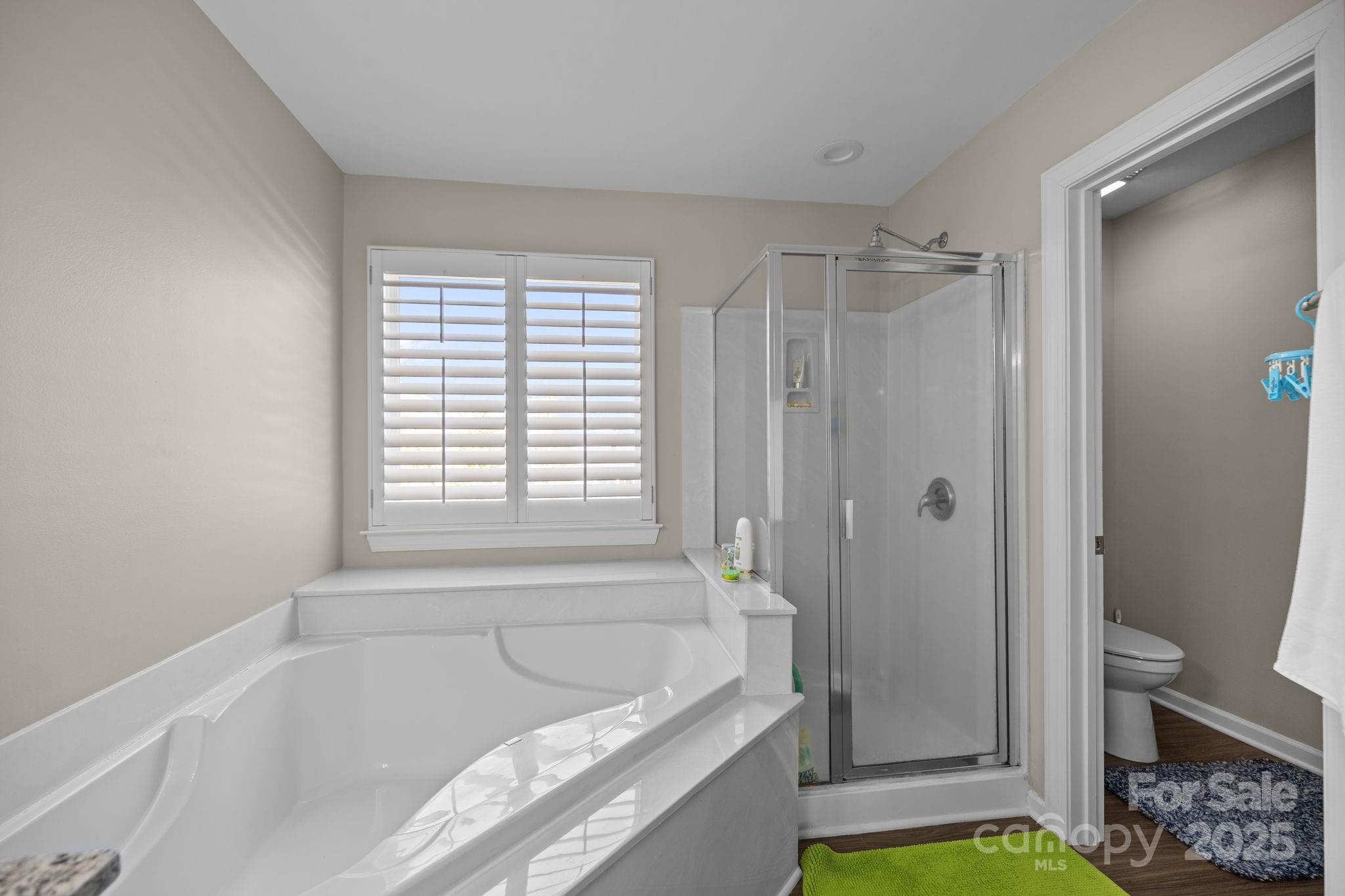 6416 Baltray Road Charlotte, NC 28278 - Photo 21 of 34 a bathroom with a tub shower and a sink