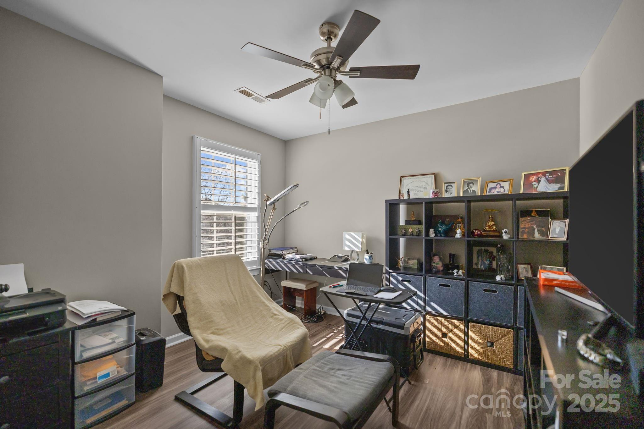 6416 Baltray Road Charlotte, NC 28278 - Photo 22 of 34 a work room with furniture and wooden floor