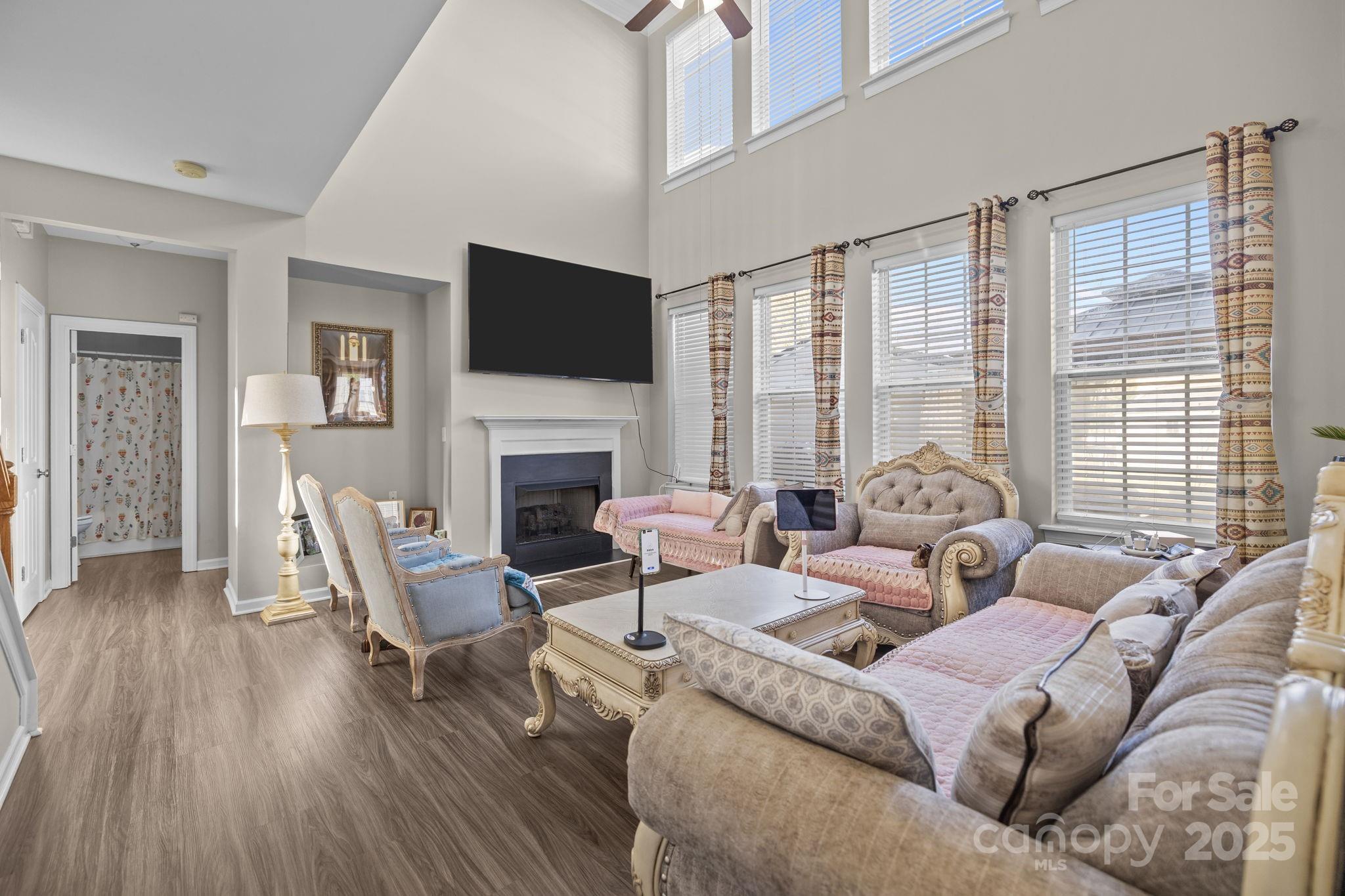 6416 Baltray Road Charlotte, NC 28278 - Photo 3 of 34 a living room with furniture fireplace and a flat screen tv