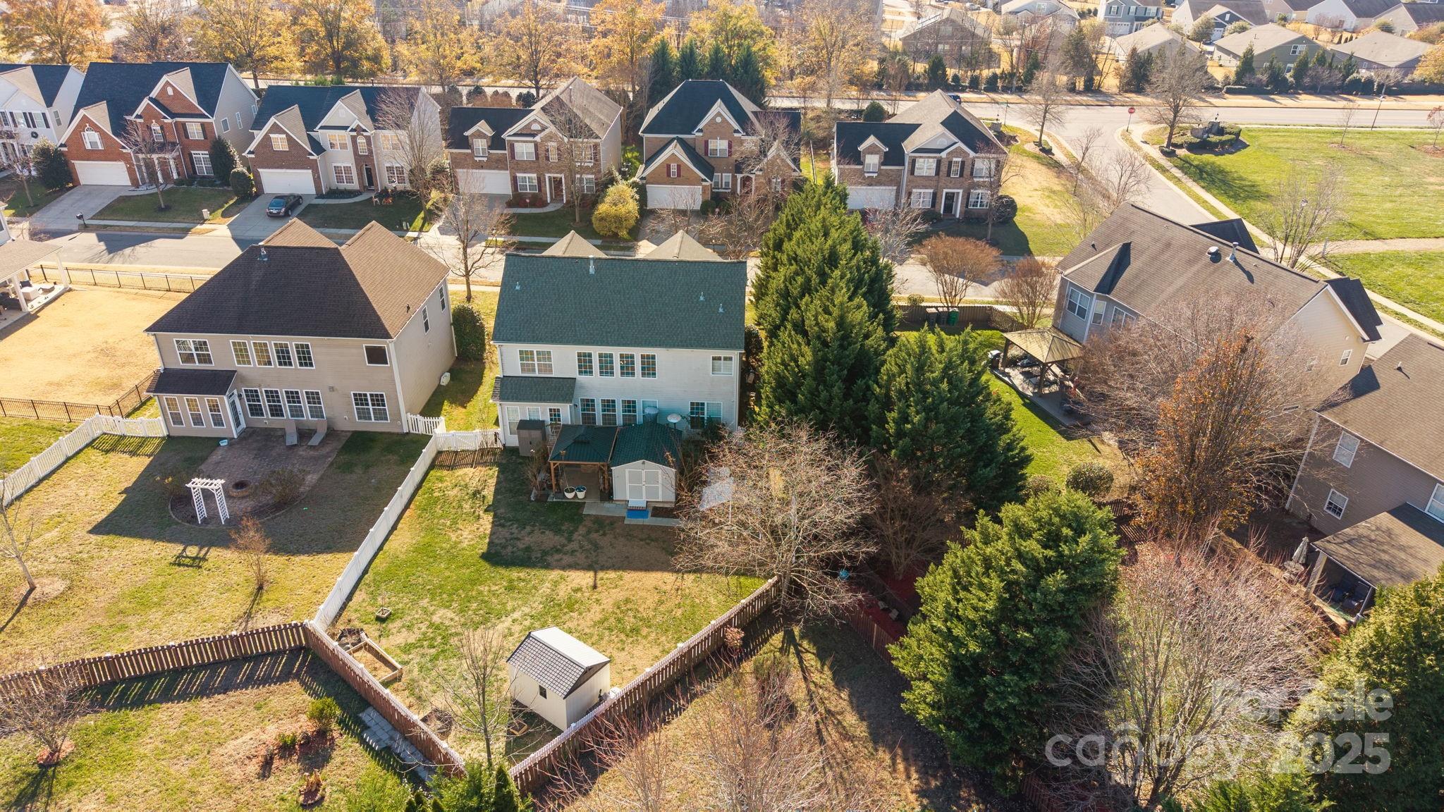 6416 Baltray Road Charlotte, NC 28278 - Photo 33 of 34 an aerial view of a house with swimming pool and lake view