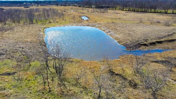 a view of a lake with a yard