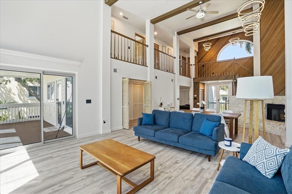 3481 Bayou Sound Longboat Key, FL 34228 - Photo 13 of 79 a living room with furniture a rug and a window