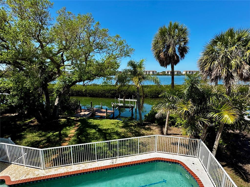 3481 Bayou Sound Longboat Key, FL 34228 - Photo 2 of 2 a view of a house with a small yard and swimming pool