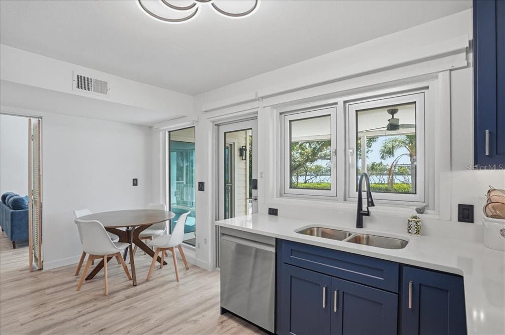 3481 Bayou Sound Longboat Key, FL 34228 - Photo 21 of 79 a spacious bathroom with a granite countertop sink a mirror and a bathtub
