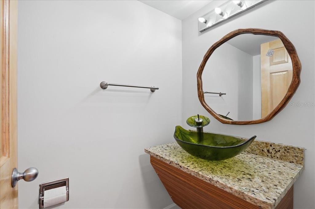 3481 Bayou Sound Longboat Key, FL 34228 - Photo 25 of 79 a room with painting on the wall and a window