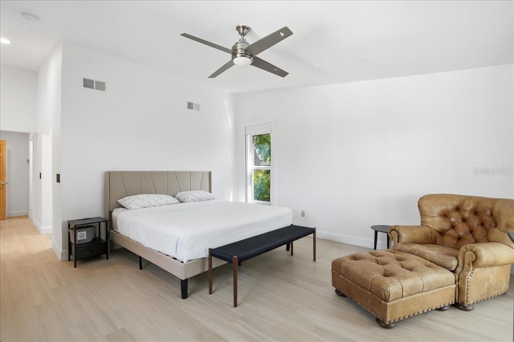 3481 Bayou Sound Longboat Key, FL 34228 - Photo 34 of 79 a bedroom with a bed and a couch