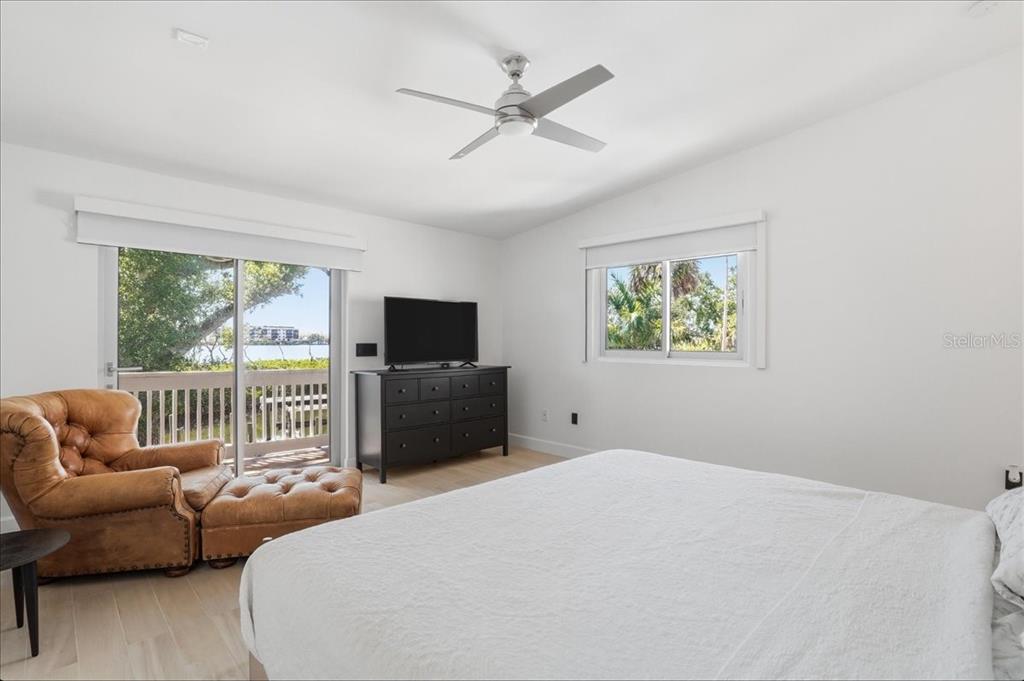 3481 Bayou Sound Longboat Key, FL 34228 - Photo 35 of 79 a bedroom with furniture and a large window