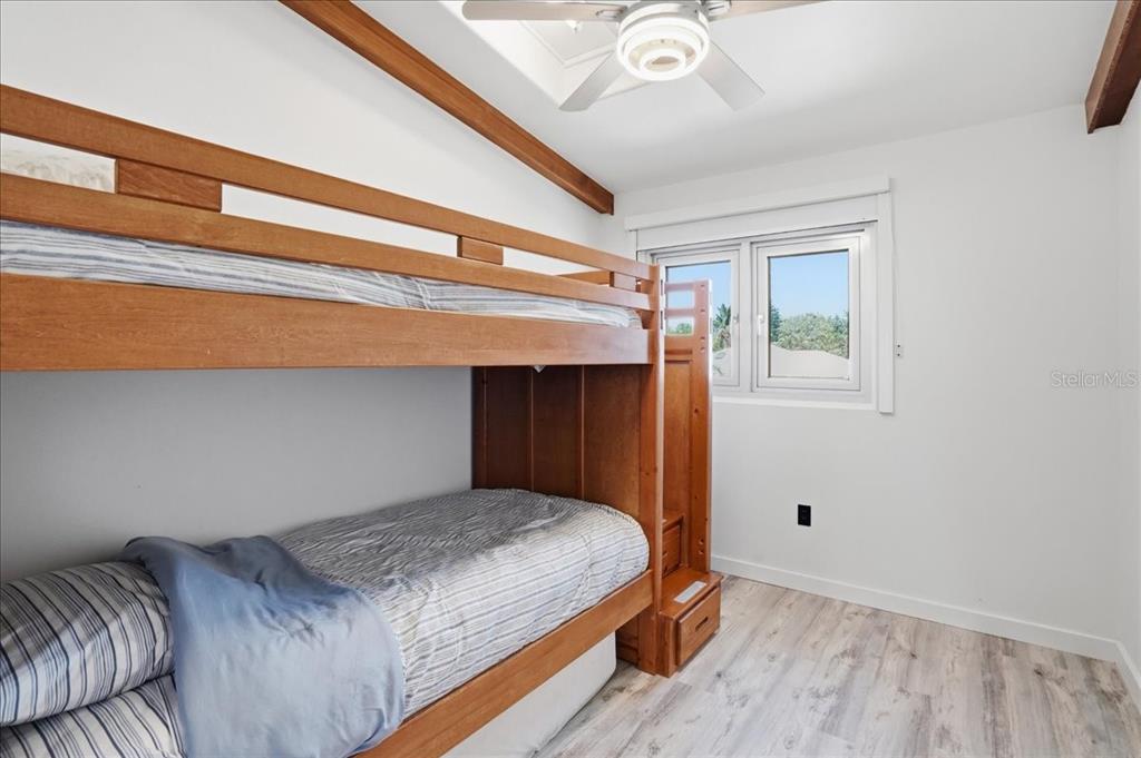3481 Bayou Sound Longboat Key, FL 34228 - Photo 40 of 79 a bedroom with a bed and a window