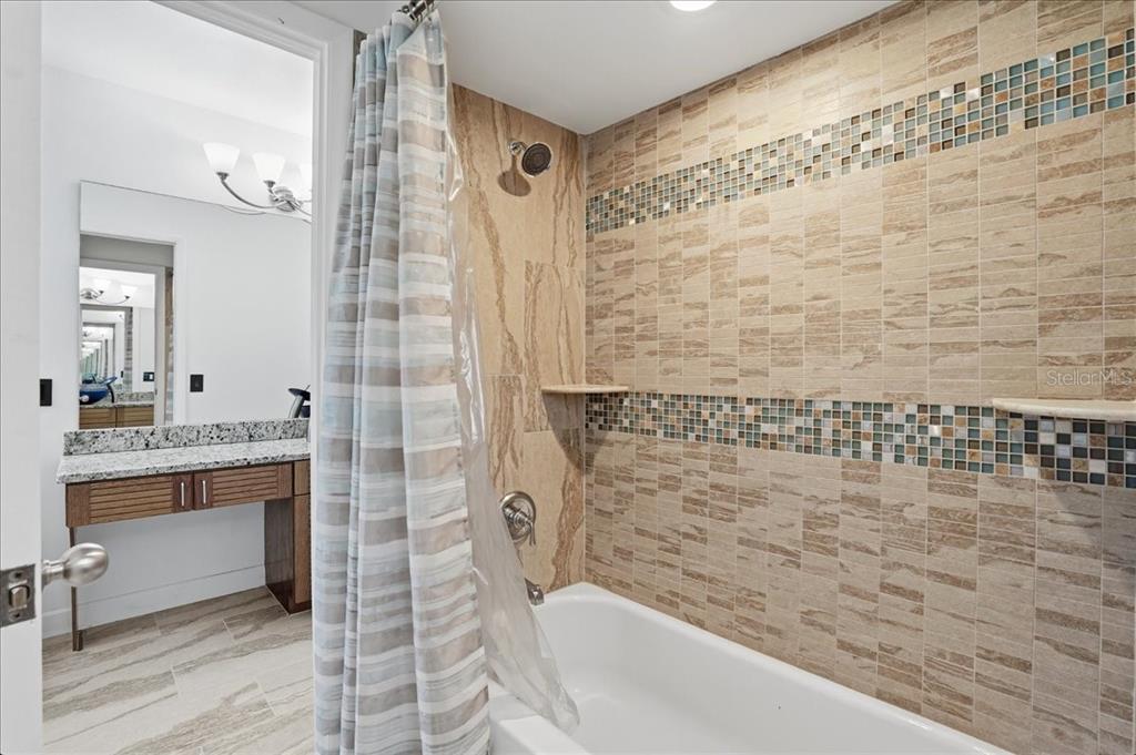 3481 Bayou Sound Longboat Key, FL 34228 - Photo 44 of 79 a bathroom with a bathtub and shower