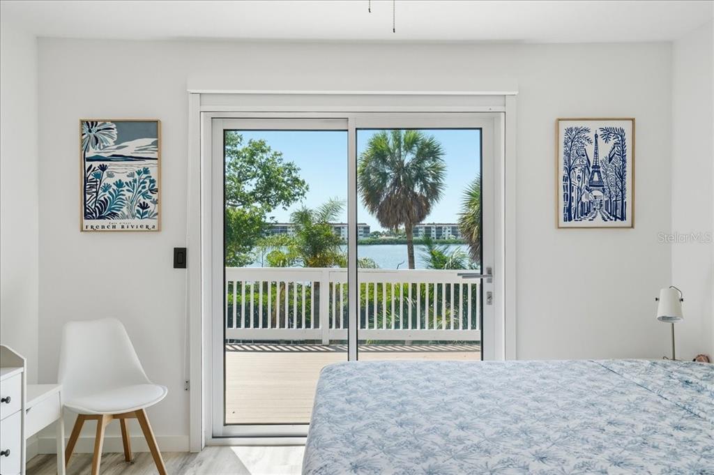 3481 Bayou Sound Longboat Key, FL 34228 - Photo 47 of 79 a bedroom with furniture and a window