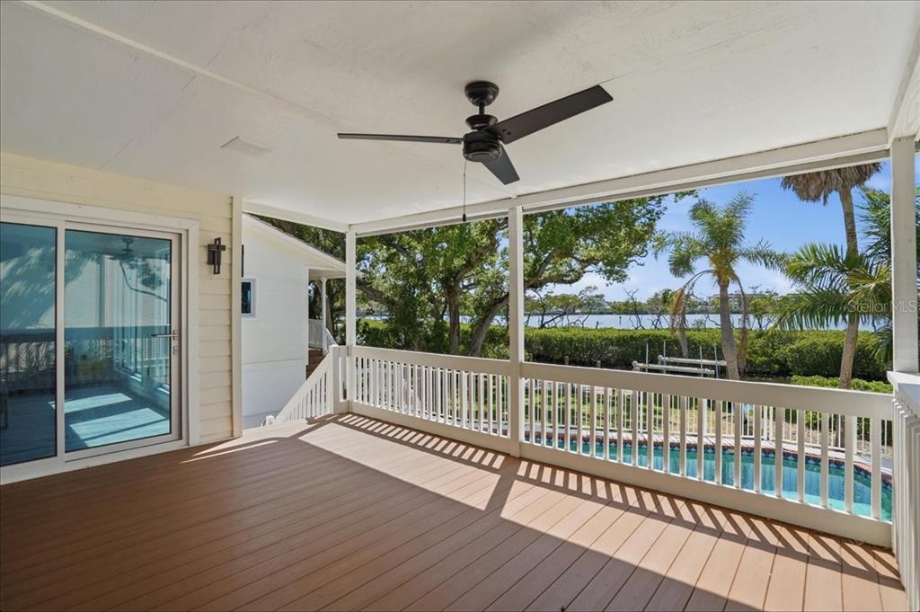 3481 Bayou Sound Longboat Key, FL 34228 - Photo 53 of 79 a view of a porch with wooden floor