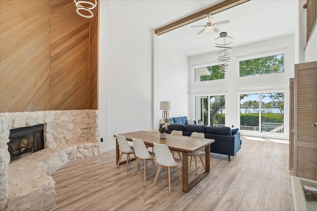 3481 Bayou Sound Longboat Key, FL 34228 - Photo 7 of 79 a living room with furniture and a fireplace