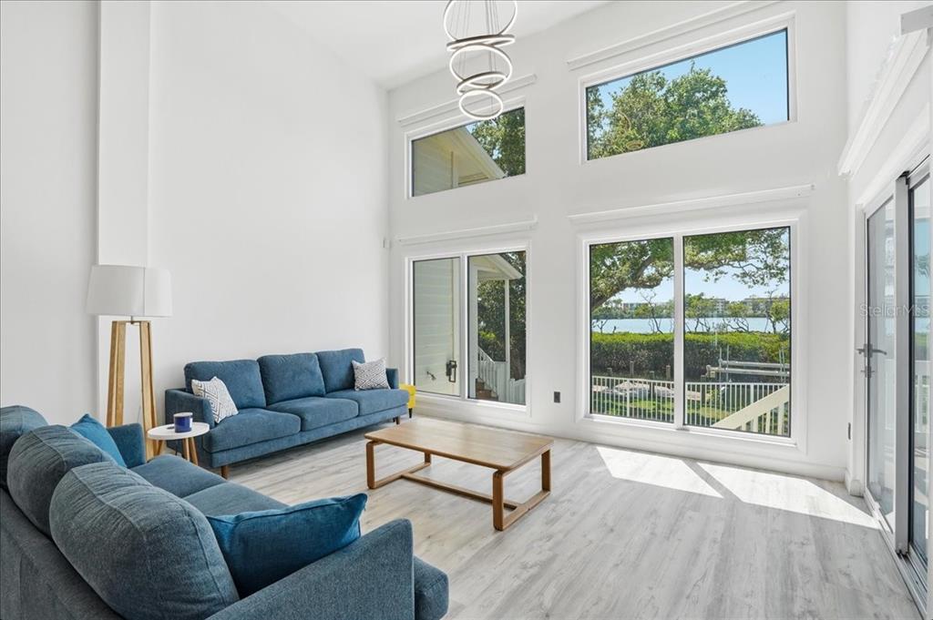 3481 Bayou Sound Longboat Key, FL 34228 - Photo 10 of 79 a living room with furniture and a large window