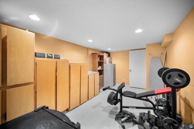 3233 Jean Street Magna, UT 84044 - Photo 28 of 33 Spacious room featuring extensive built-in cabinetry, recessed lighting, and a white interior door