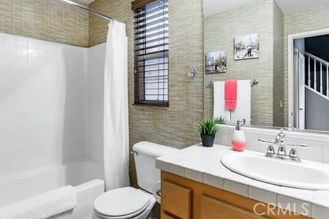 a front view of a house with lots of green space