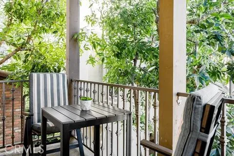 a view of a balcony with chairs