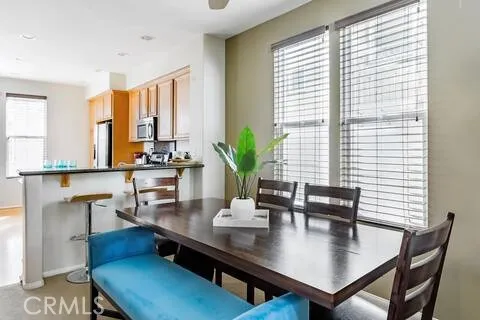 a view of a dining room with furniture and window