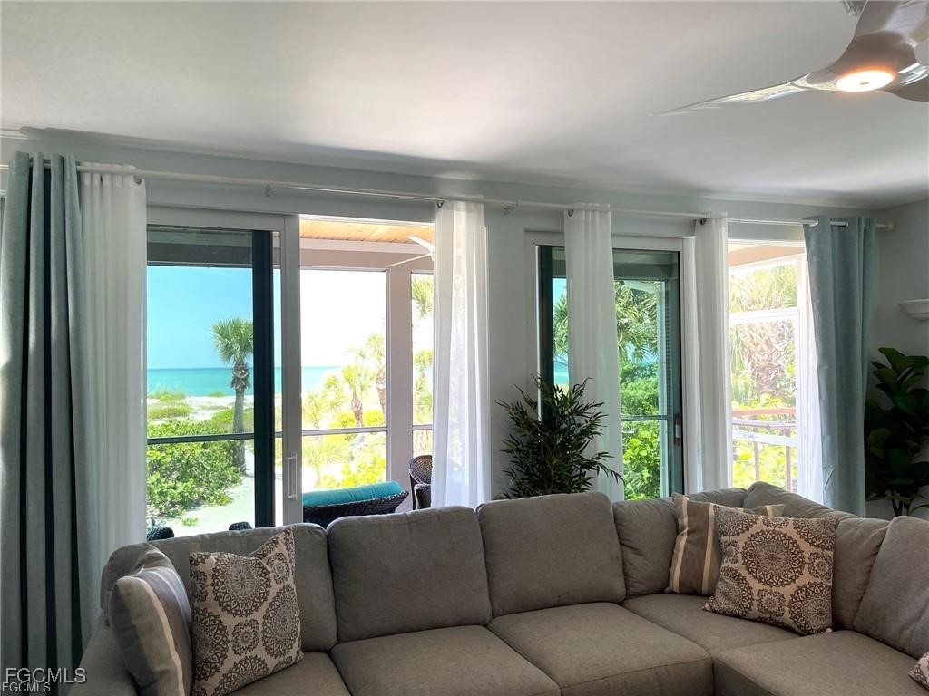 640 Gulf Lane, Unit 3 Captiva, FL 33924 - Photo 19 of 50 a living room with furniture and a large window