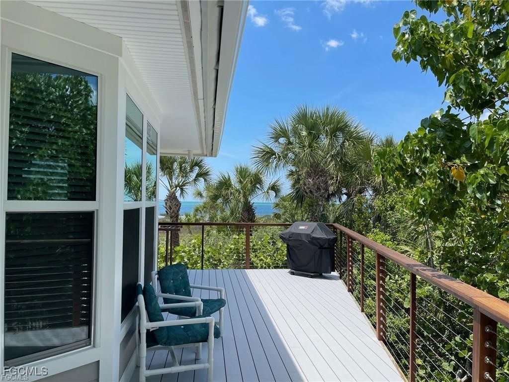 640 Gulf Lane, Unit 3 Captiva, FL 33924 - Photo 25 of 50 a view of a balcony with chairs