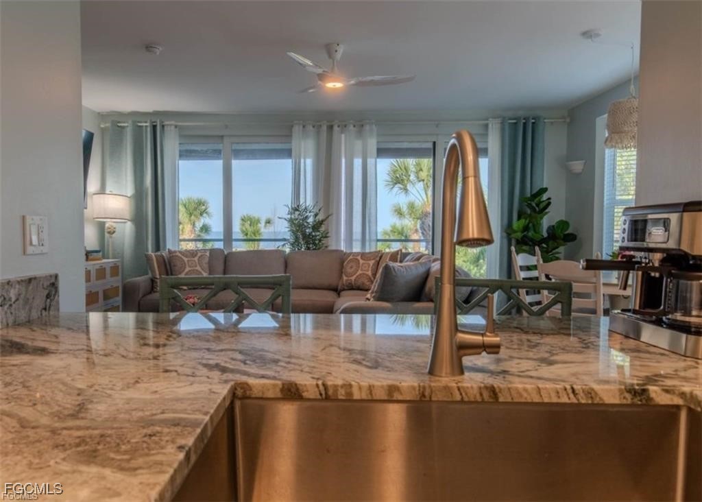 640 Gulf Lane, Unit 3 Captiva, FL 33924 - Photo 29 of 50 a living room with fireplace furniture and a large window