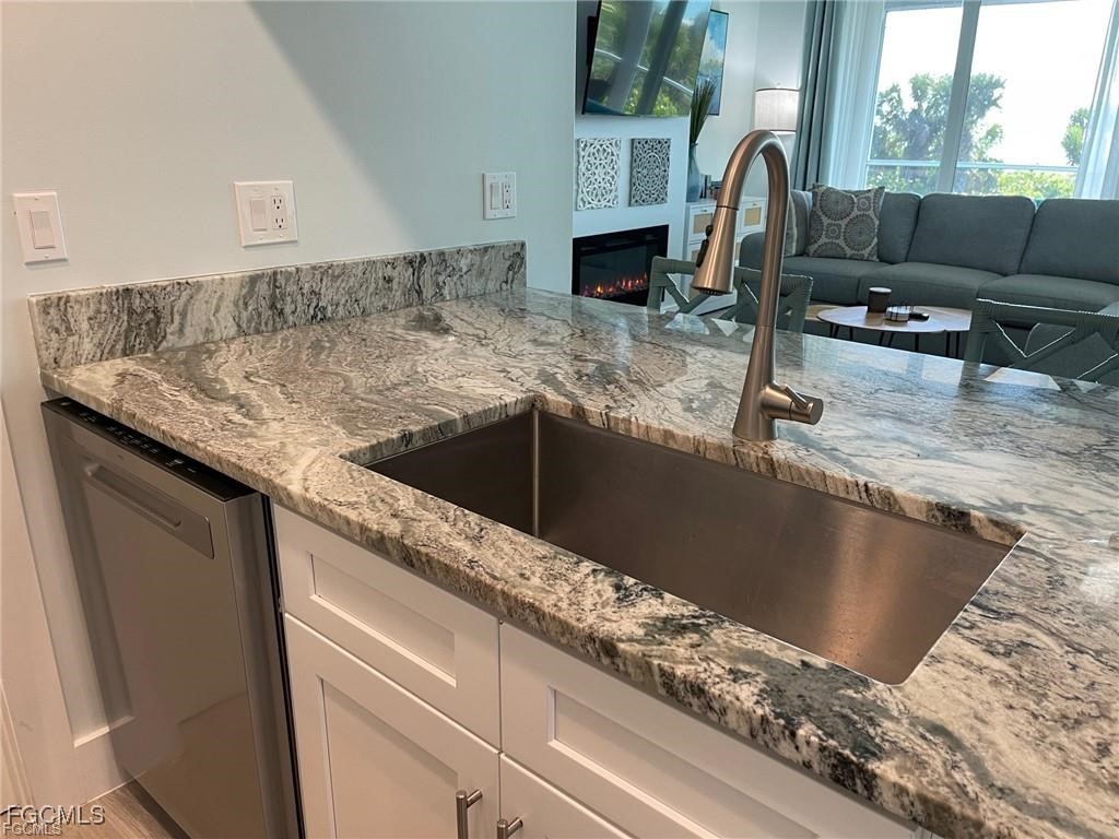 640 Gulf Lane, Unit 3 Captiva, FL 33924 - Photo 30 of 50 a kitchen with a granite countertop sink and a granite counter tops