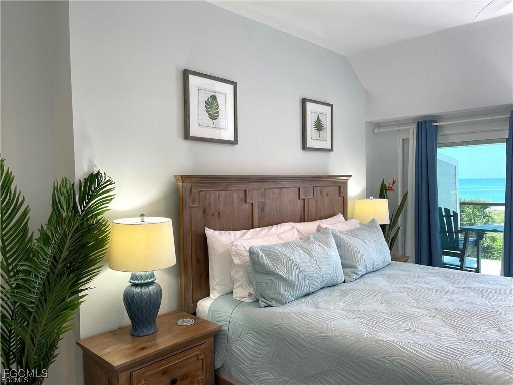 640 Gulf Lane, Unit 3 Captiva, FL 33924 - Photo 37 of 50 a bedroom with a bed and a couch