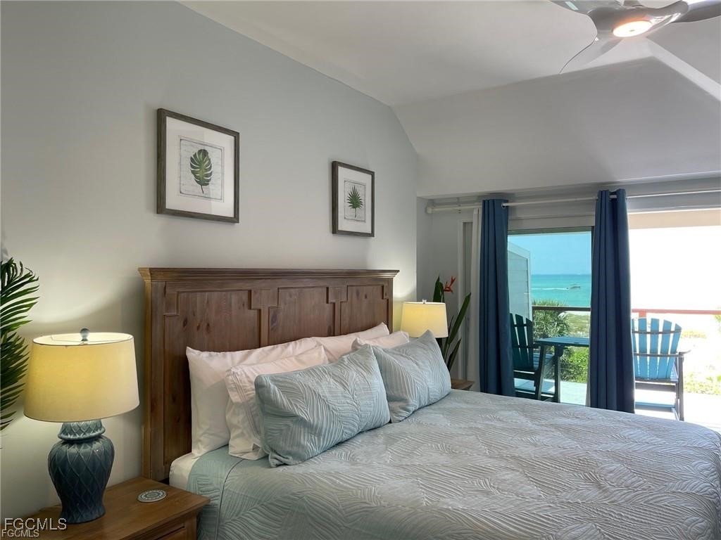 640 Gulf Lane, Unit 3 Captiva, FL 33924 - Photo 38 of 50 a bedroom with a bed and window