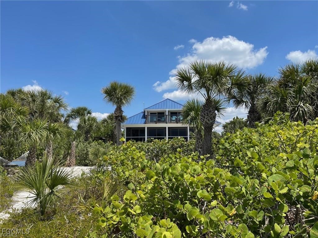 640 Gulf Lane, Unit 3 Captiva, FL 33924 - Photo 47 of 50 a view of a house with a yard and potted plants