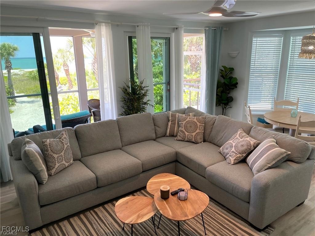 640 Gulf Lane, Unit 3 Captiva, FL 33924 - Photo 10 of 50 a living room with furniture and a large window