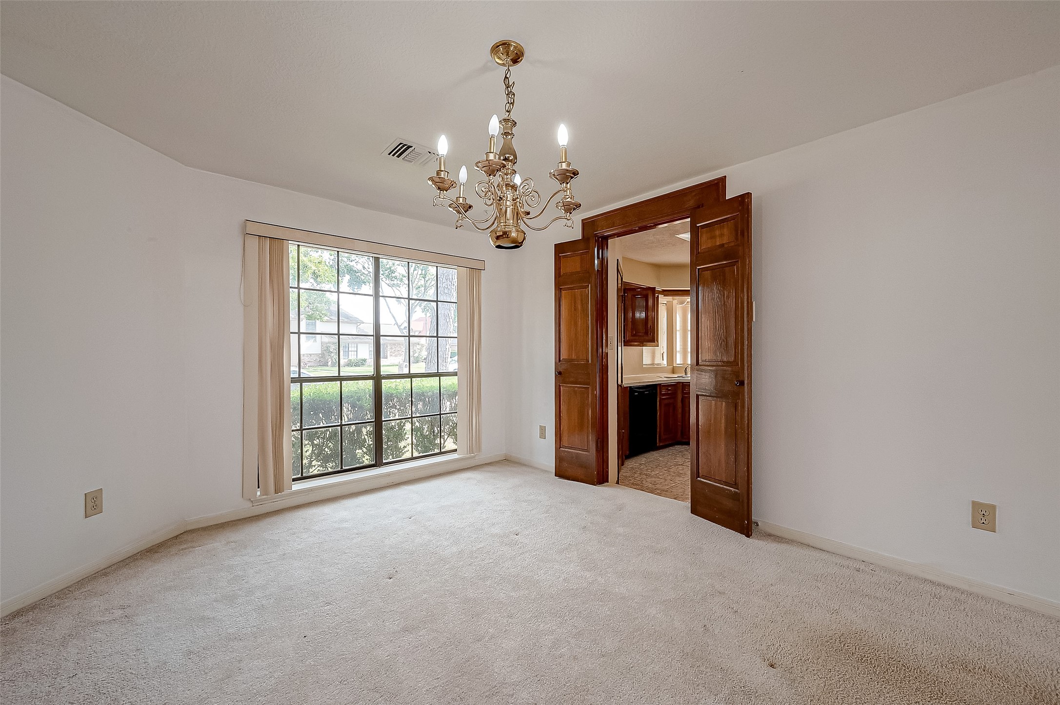 14818 La Rana Drive Houston, TX 77083 - Photo 13 of 50 a view of a big room with windows and chandelier