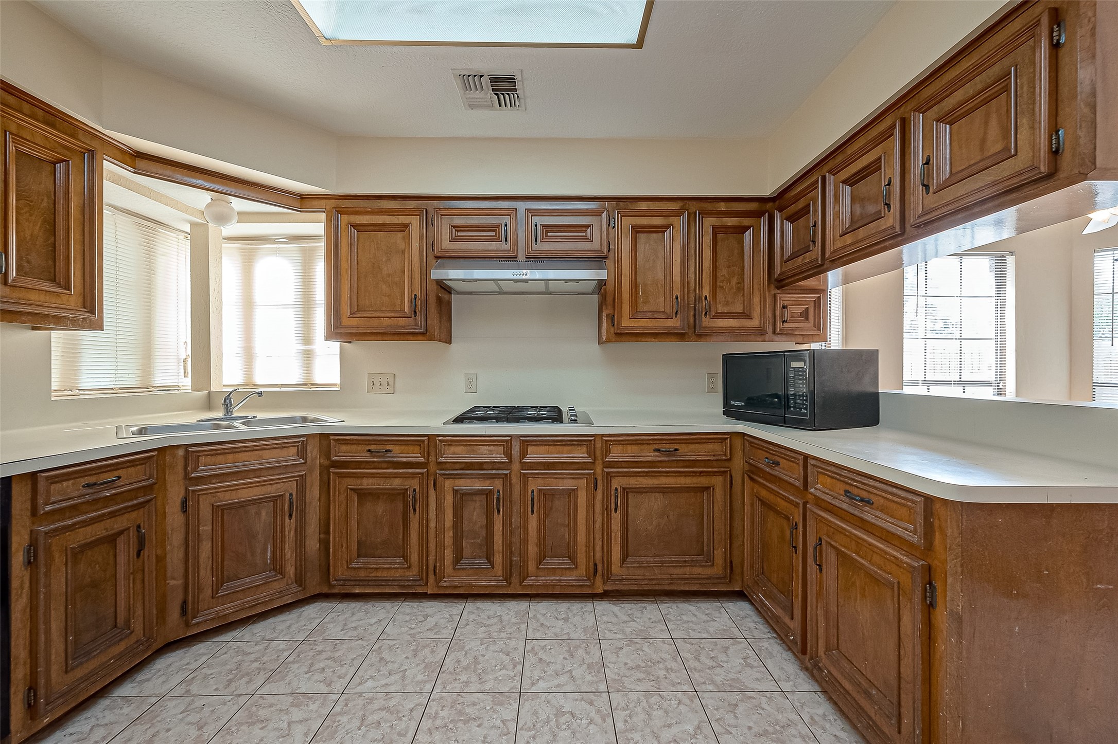 14818 La Rana Drive Houston, TX 77083 - Photo 16 of 50 a kitchen with stainless steel appliances granite countertop a sink and cabinets