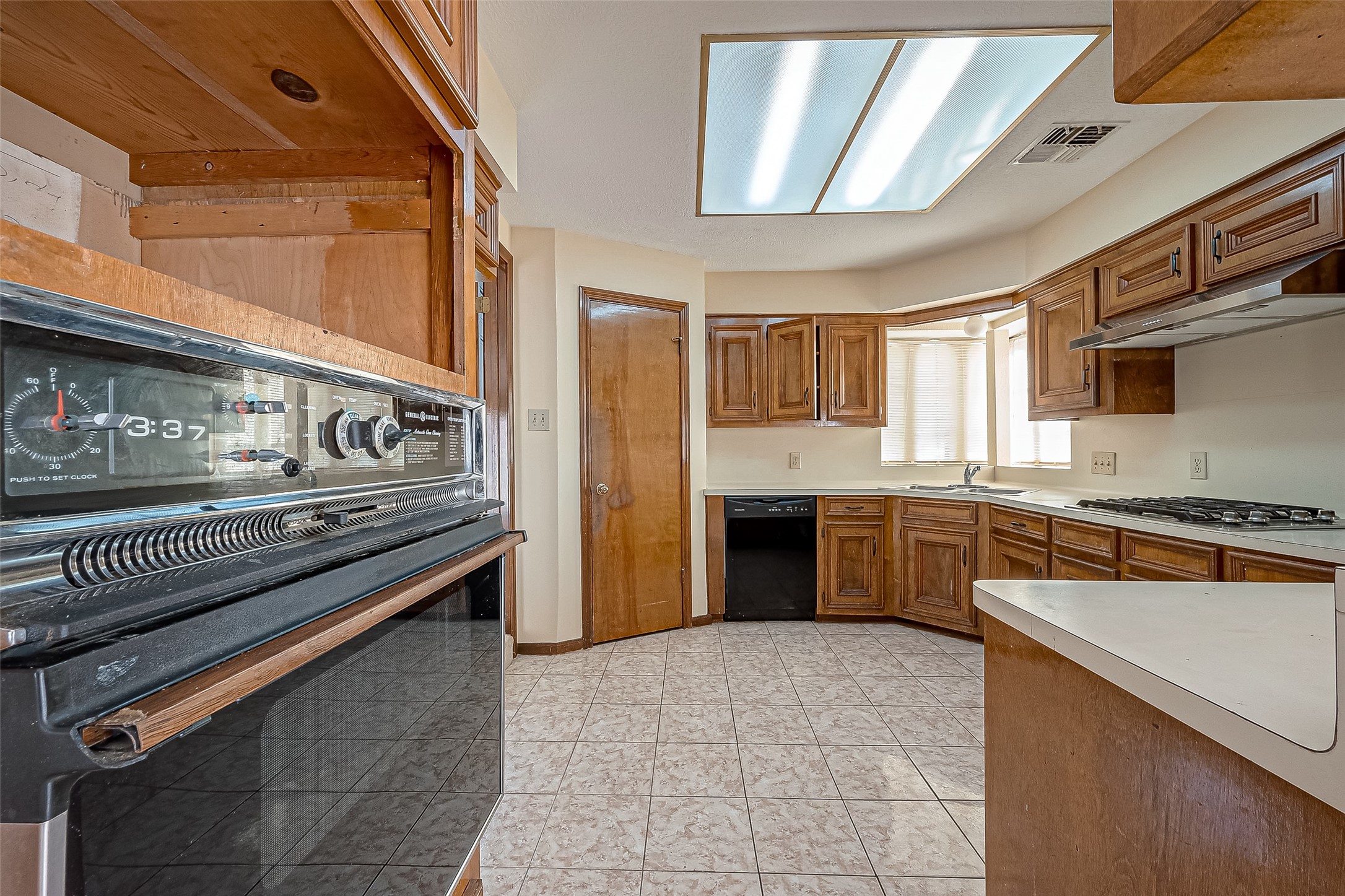 14818 La Rana Drive Houston, TX 77083 - Photo 21 of 50 a kitchen with stainless steel appliances granite countertop a stove and a sink