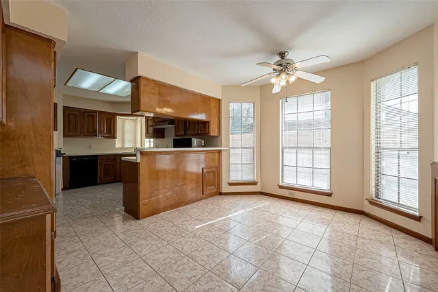 a view of a kitchen with a sink and windows